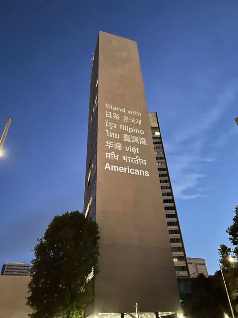 A tall building with writing on it

Description automatically generated with medium confidence
