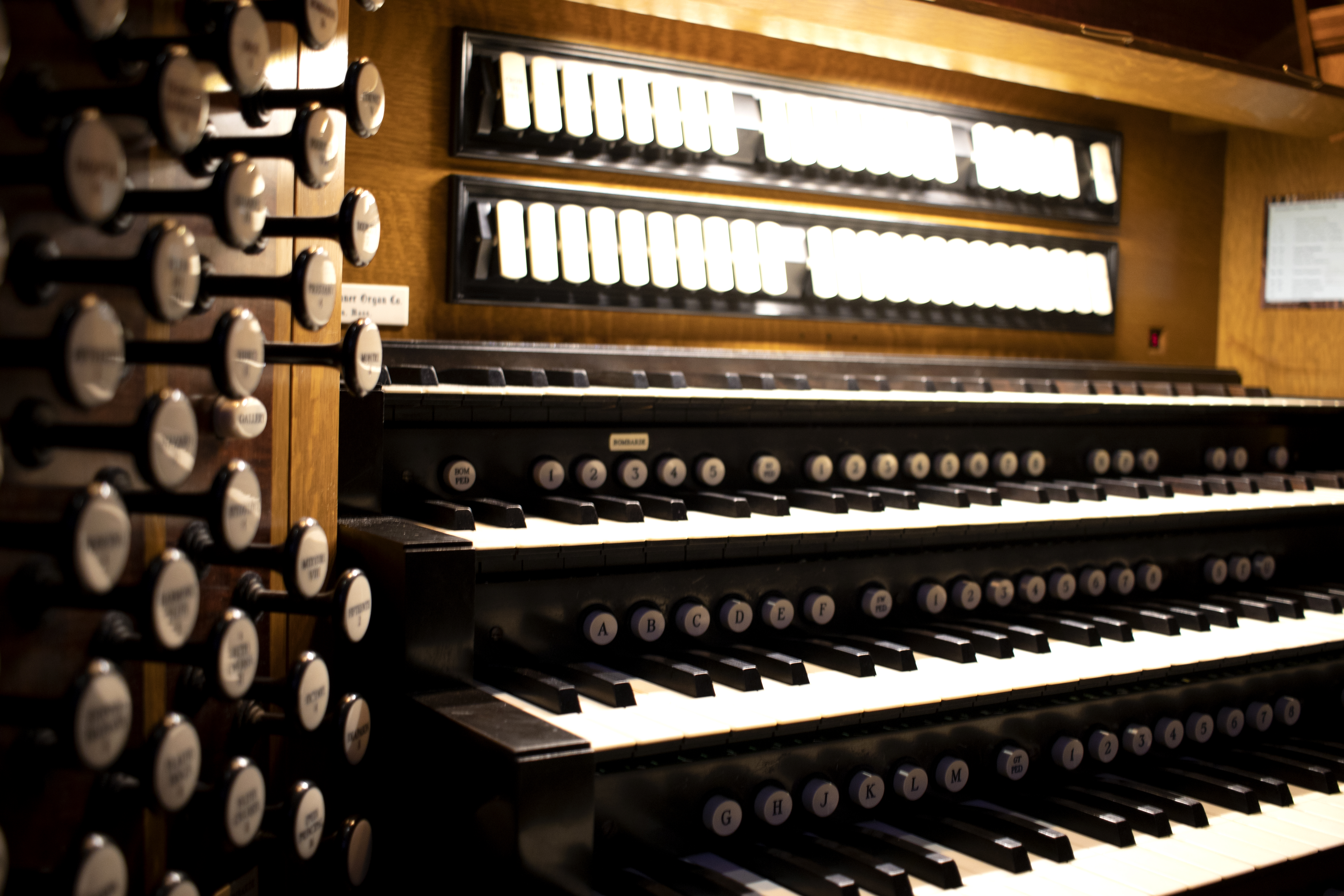 Closeup of the organ keys in dramatic light.