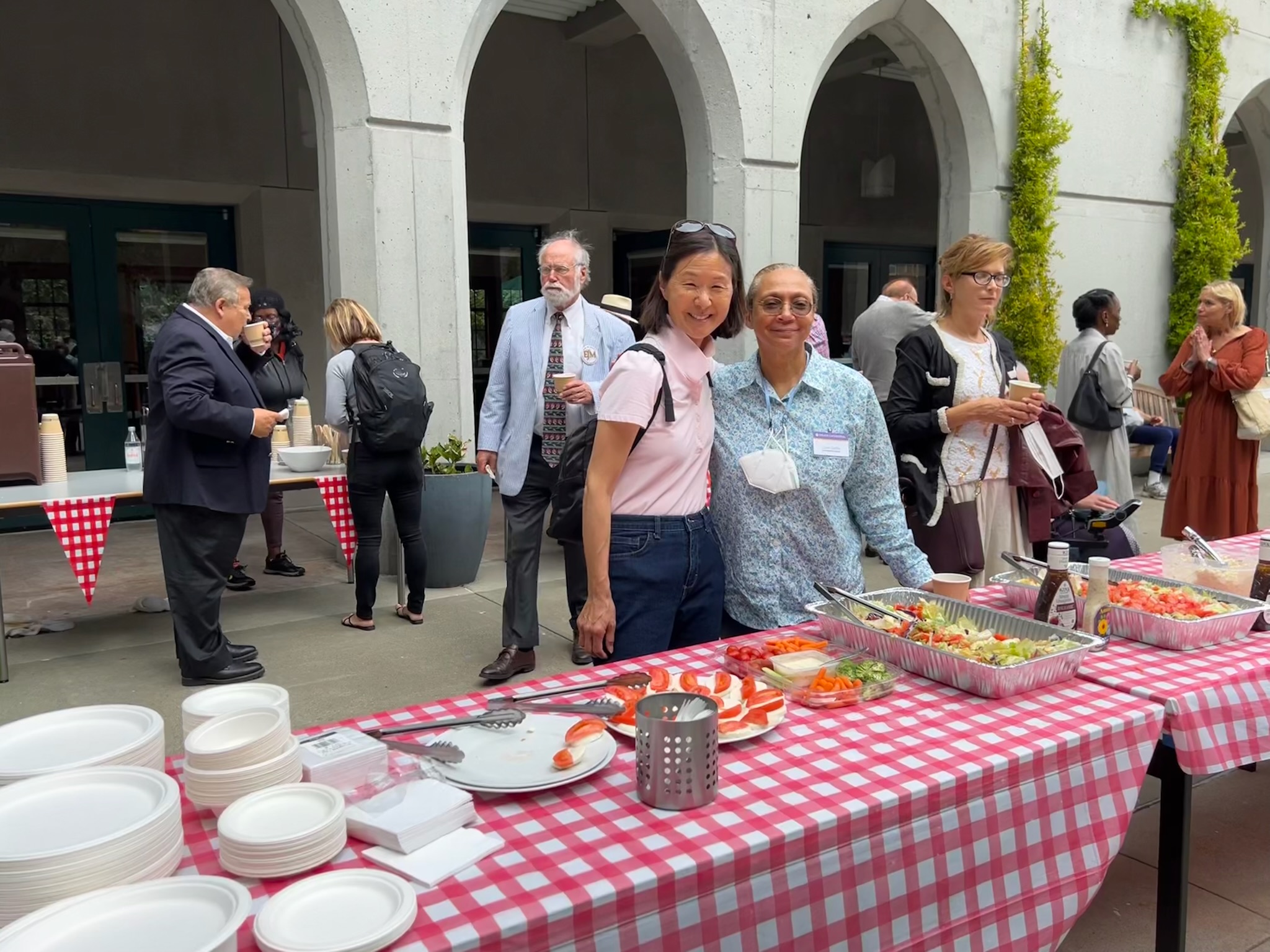 Happy visitors pose for photo at the Newcomer's Brunch